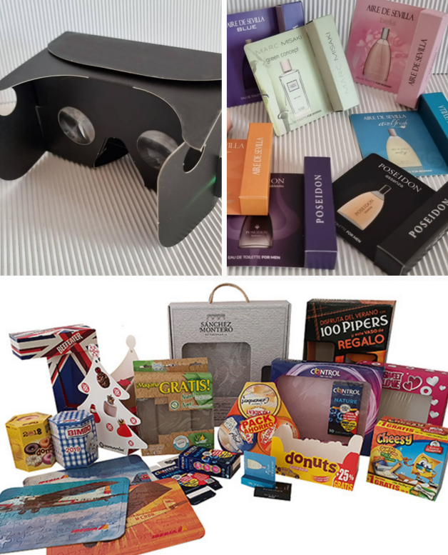 Caja de cartón con lentes de realidad virtual y varios productos de diferentes marcas.